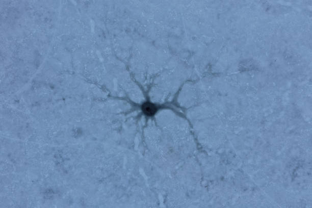 istock ice hole, frozen lake, aerial view 1132682418