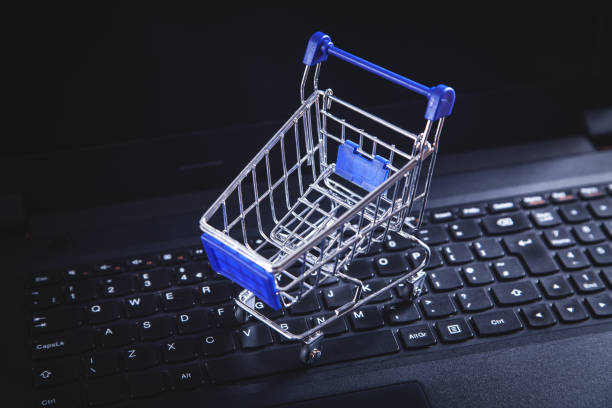 istock Shopping cart on laptop keyboard. 1132684132