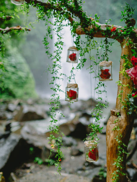istock Arch with beautiful flowers and decorations. Wedding ceremony at waterfall. 1132686955