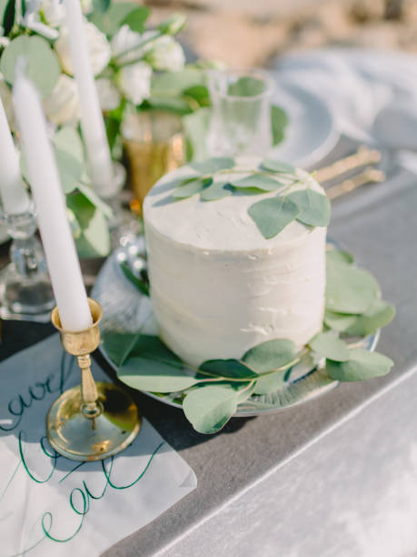 istock Wedding sweet cake with cream and eucalyptus leaves for decoration. Wedding dinner 1132687141