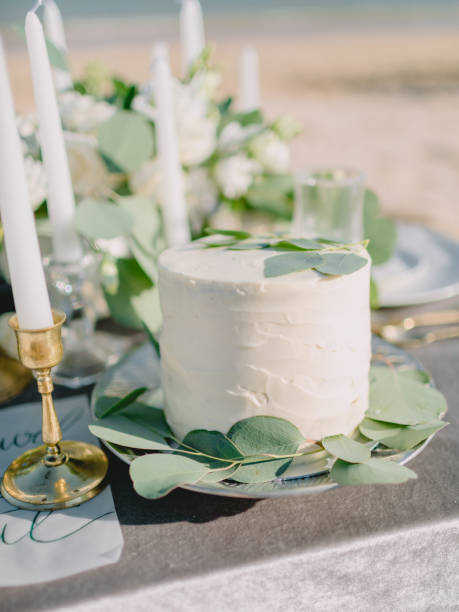 istock Wedding sweet cake with cream and eucalyptus leaves for decoration. Wedding dinner 1132687143