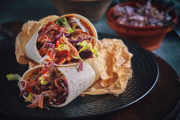 Pulled Pork Wrap Sandwich with Tomato, Salad and Chili