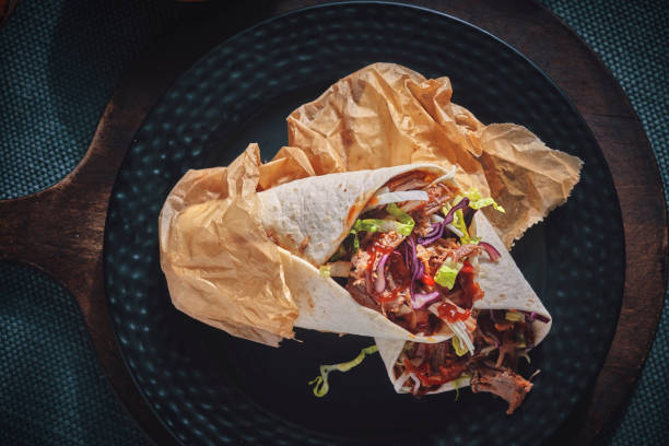 Pulled Pork Wrap Sandwich with Tomato, Salad and Chili