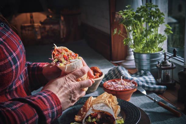 istock Pulled Pork Wrap Sandwich with Tomato, Salad and Chili 1132690892