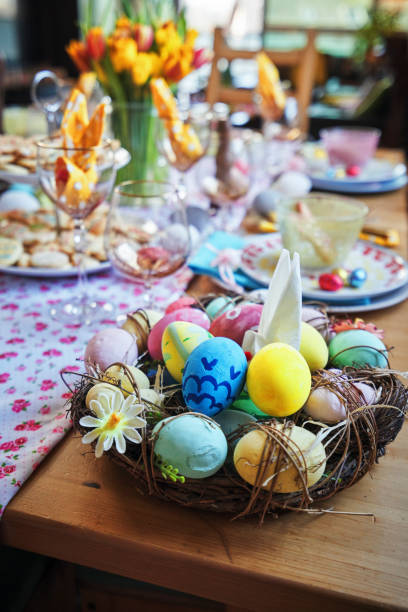 istock Decorated Table for Easter with Easter Eggs, Cookies, Cake and Flowers 1132691108