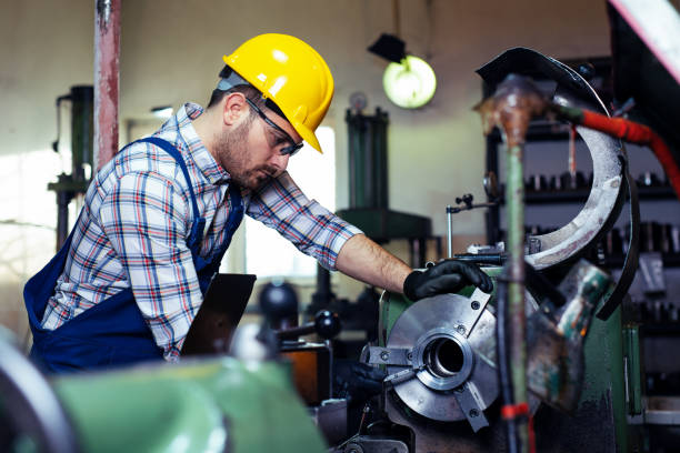 istock Turner worker is working on a lathe machine in a factory. 1132692103