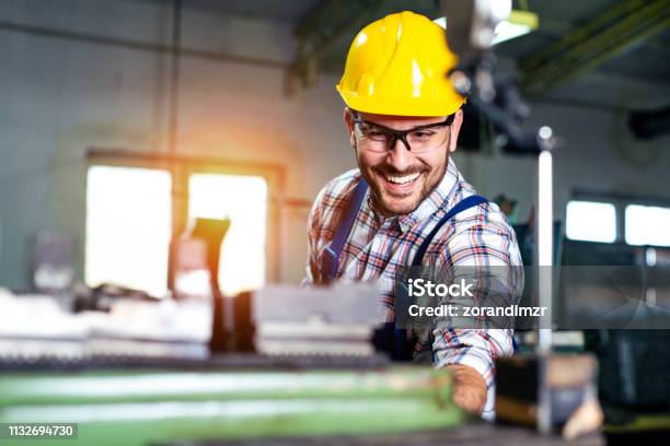 Turner Worker Is Working On A Lathe Machine In A Factory Stock Photo - Download Image Now