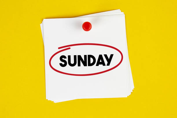 Mark Sunday on the calendar Mark Sunday on the calendar on yellow background weekend activities stock pictures, royalty-free photos & images