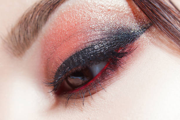 istock Amazing Bright eye makeup with a wide arrow. Brown and red tones, colored eyeshadow. 1132698329