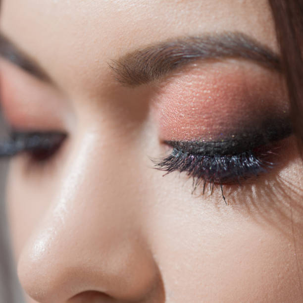 istock Amazing Bright eye makeup with a wide arrow. Brown and red tones, colored eyeshadow. 1132698337