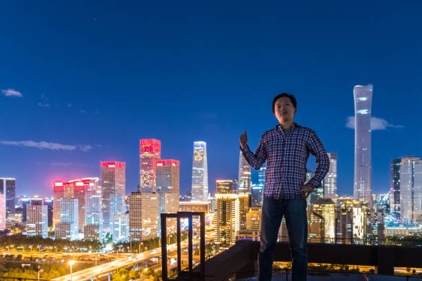 A man Thumb up in Front of Modern City