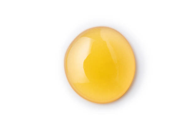istock Macro one honey drops isolated on white background, File contains a clipping path. 1132699579