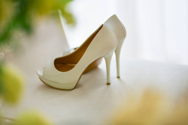istock Wedding shoes stand on a white chair 1132700856