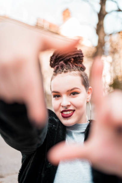 istock Hipster girl making a square with fingers 1132700929
