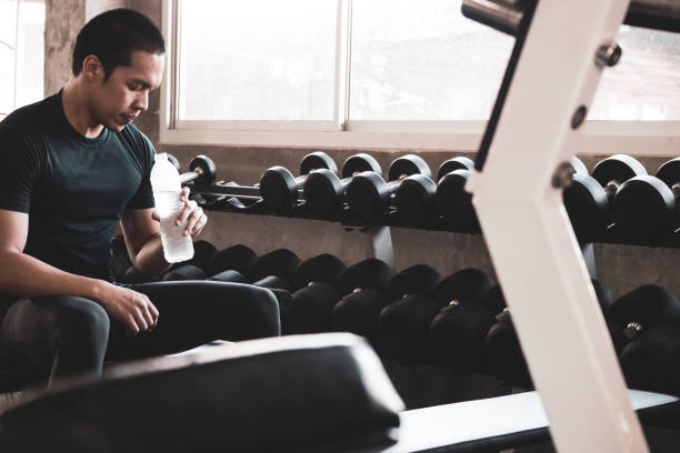 istock Attractive young man taking a break after exercise at the gym 1132701123