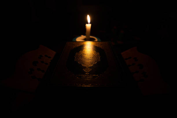 istock Quran in the mosque at night and light from the candle 1132702049