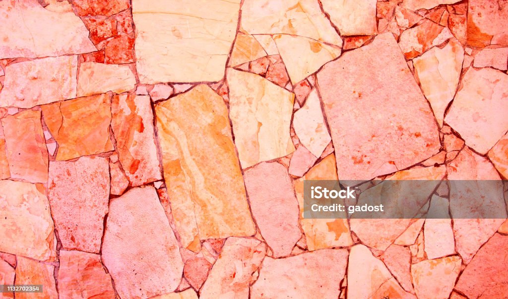 Living coral textured background Closeup of trendy coloured living coral, orange and pink abstract sandstone mosaic wall. For pattern, texture and background your concept or product Abstract Stock Photo