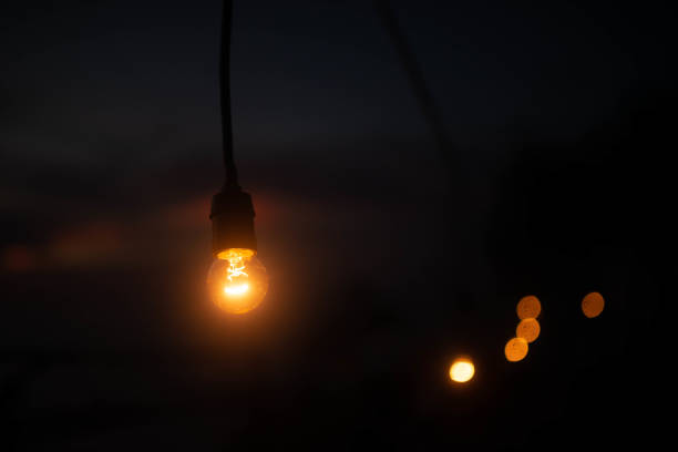 istock retro lamp shines on a dark background of night 1132704272