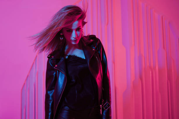 istock Beautiful girl dancing in retro wave on the neon light 1132705016