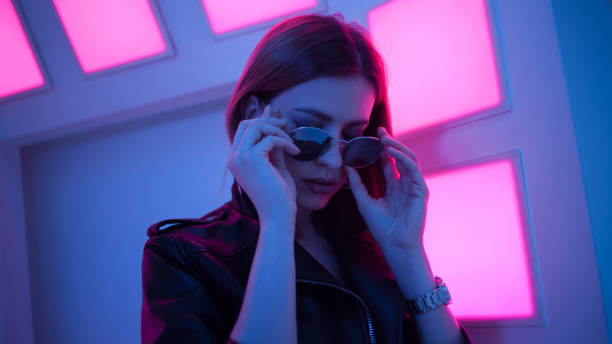 istock Futuristic style portrait in blue and purple light. 1132705072