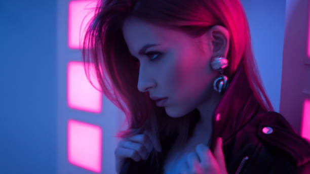 istock Futuristic style portrait in blue and purple light. 1132705090