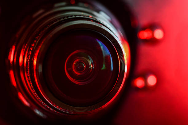 istock Camera lens and red backlight . Horizontal photography 1132705098