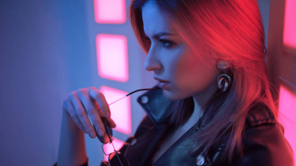 istock Futuristic style portrait in blue and purple light. 1132705115