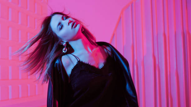 istock Beautiful girl dancing in retro wave on the neon light 1132705158