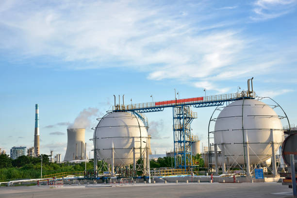 istock Refinery storage tanks with coal-fired power plants under the blue sky white clouds 1132706718