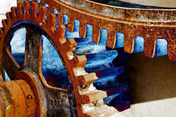 Photo of Rusty gears with unnatural blue light