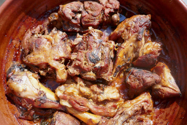 istock Appetizing roasted lamb in a  pan close-up 1132711534