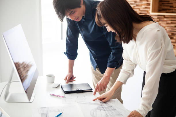 istock Designers looking at the drawings and making a plan of construction 1132713520