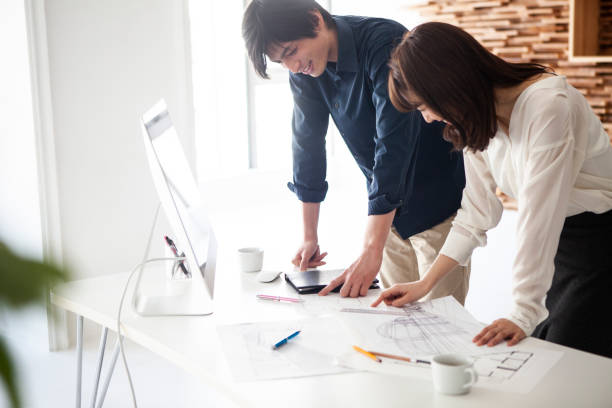 istock Designers looking at the drawings and making a plan of construction 1132713776
