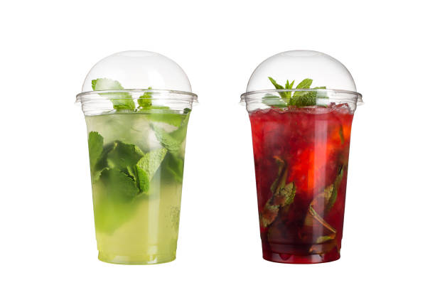 istock Delicious fruit smoothies in plastic cups, on a white background. Two cocktails with a taste of mojito and berry mojito. 1132713874