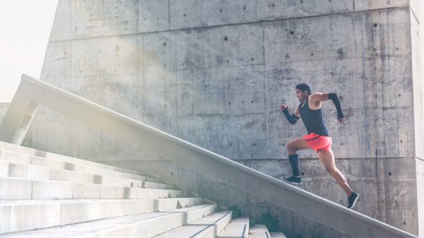 istock Muscular hispanic Young man training working out outdoors.Concret background wall with copy space area for text message or advertising content.Sunlights, flare effects. 1132714722