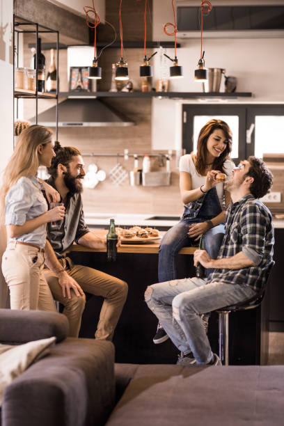 istock Young happy couples having fun on a party at home. 1132715921