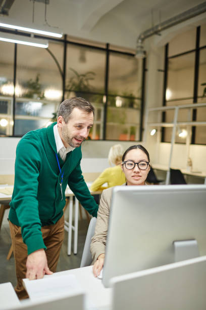 istock Designer showing graphic design to manager 1132716062