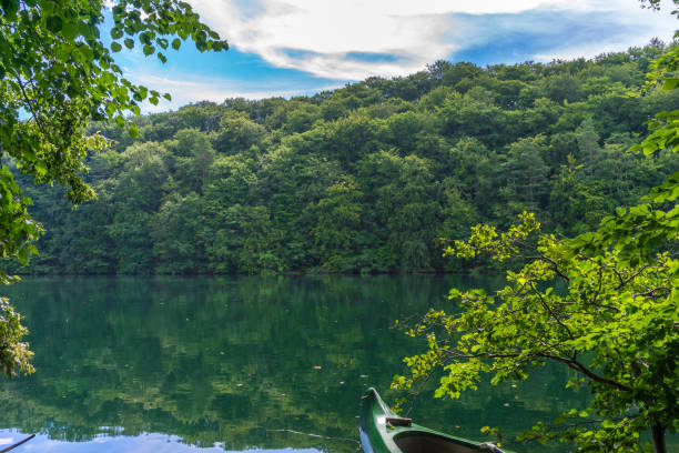 istock Canoe in beautiful lake landscape 1132717785