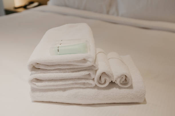 istock white towel decoration on bed in bed room interior - Image 1132719279