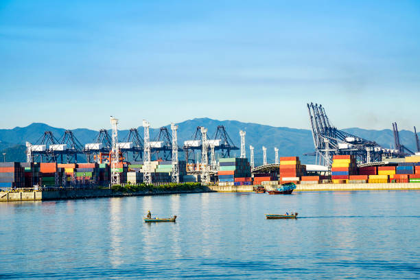 istock Industrial port container crane with a cruise ship 1132719907