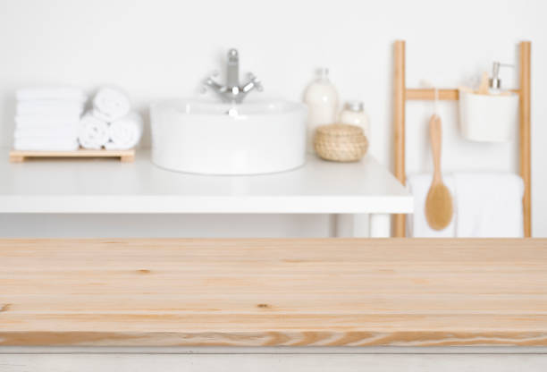 istock Wooden table top over blurred bathroom interior as the background 1132720216