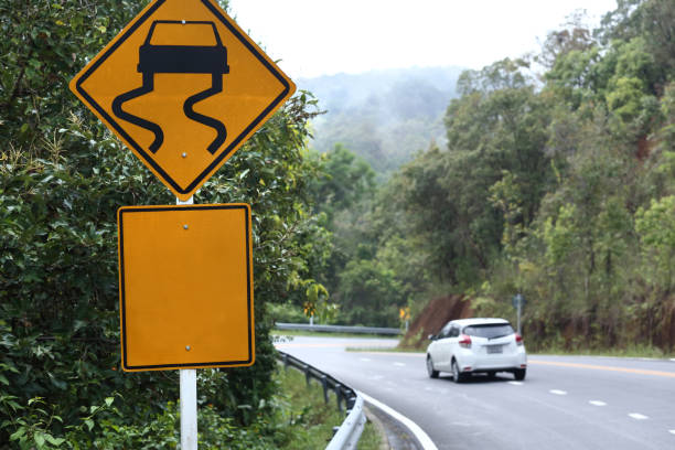 istock Traffic alerts sign and car driving 1132722151