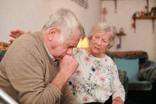 senior health issues senior man with wife at home coughing badly Asthma stock pictures, royalty-free photos & images