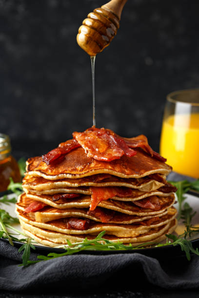 istock Pancakes with crispy bacon and maple syrup in a plate. Morning Breakfast 1132724717