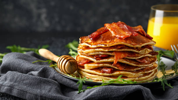 istock Pancakes with crispy bacon and maple syrup in a plate. Morning Breakfast 1132724770