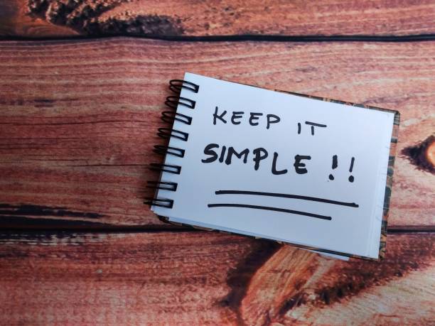 istock Top View simple photo illustration for keep it simple, block note at artrifical wooden table 1132726664