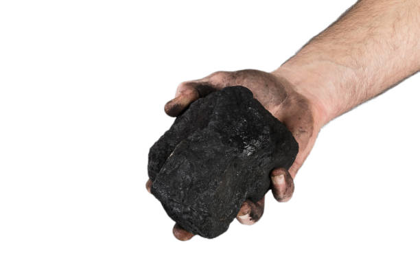 istock Coal mining: coal miner in hand. Coal and carbon dioxide emissions. 1132726792