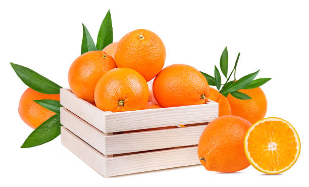 istock Oranges in a wooden box isolated on white background with clipping path 1132726898