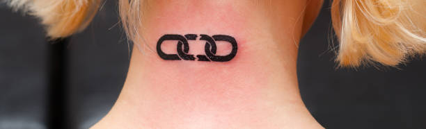 istock Freshly maid tattoo of broken chain symbolizing freedom 1132728489