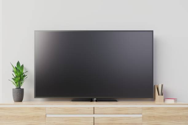 istock Tv mockup with blank black screen on cabinet 1132728613